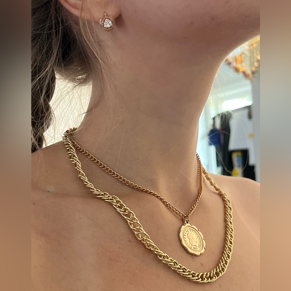 Gold chain necklace with a coin